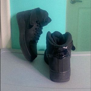 Nike Air Force 1s high tops in black